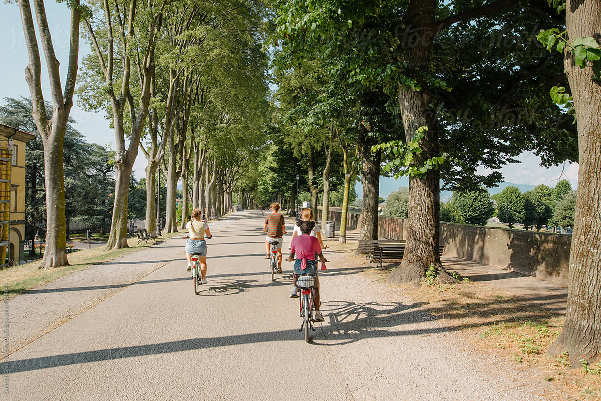 teens-on-a-bicycle-tour-of-lucca-italy-by-stocksy-contributor-gabi