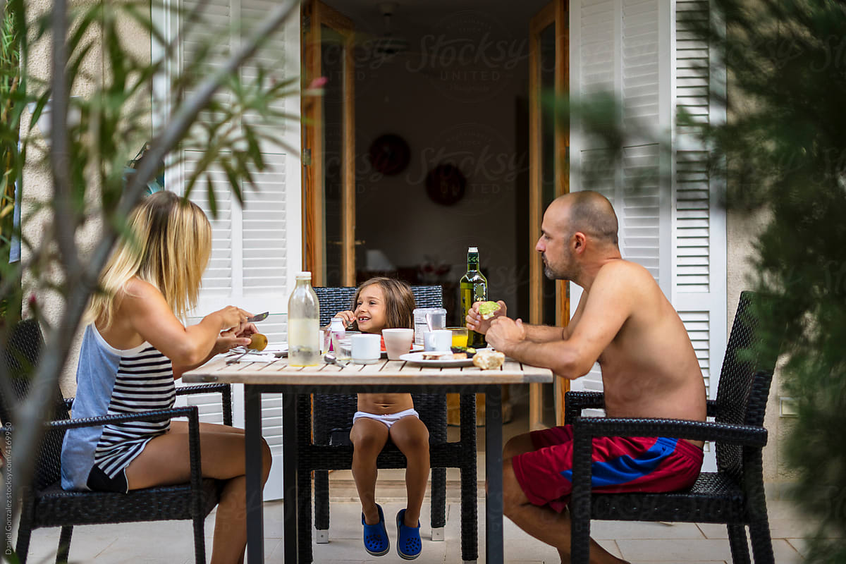 Family having breakfast on terrace