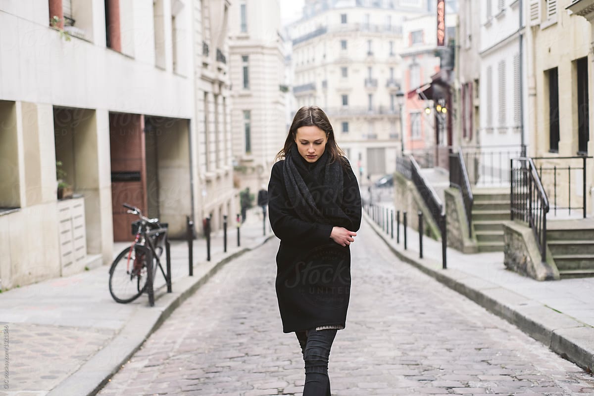 Cool young woman walking in Paris