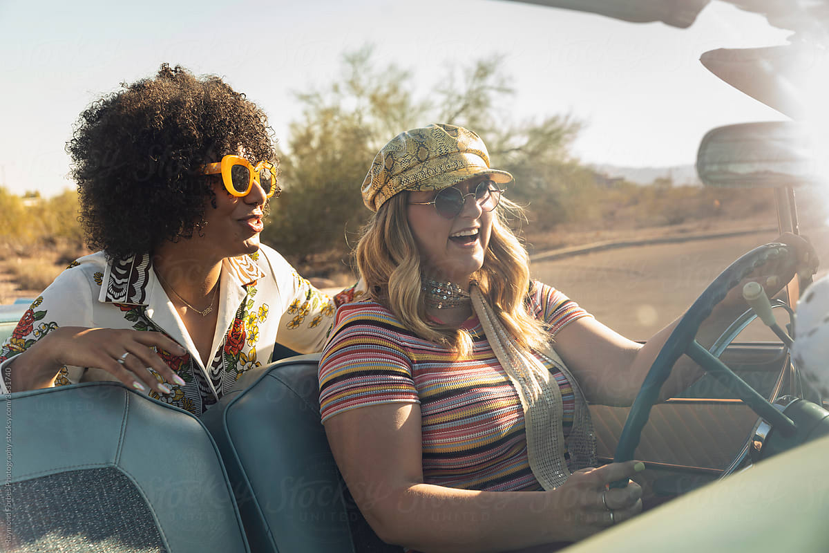 Two young friends in cool car  on Road Trip in American West