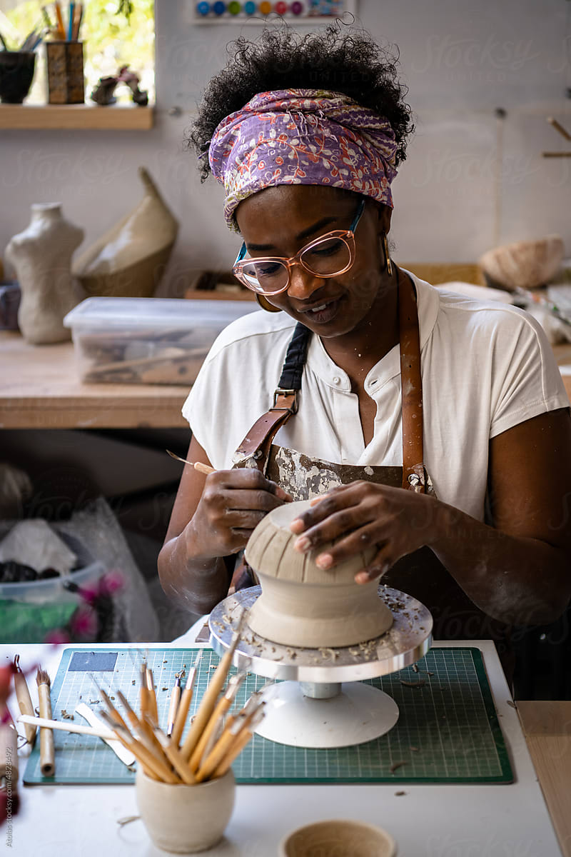 Woman crafting pottery artwork