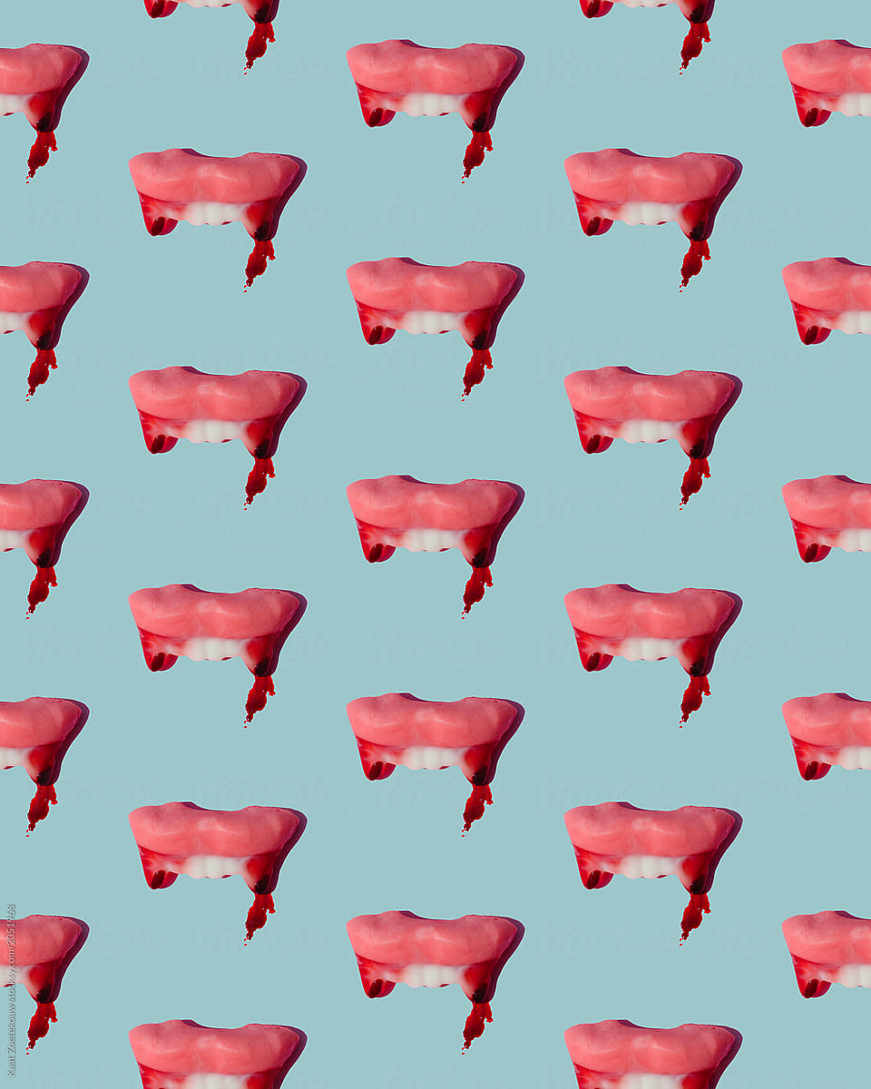 Pattern of bloodied vampire teeth on light teal