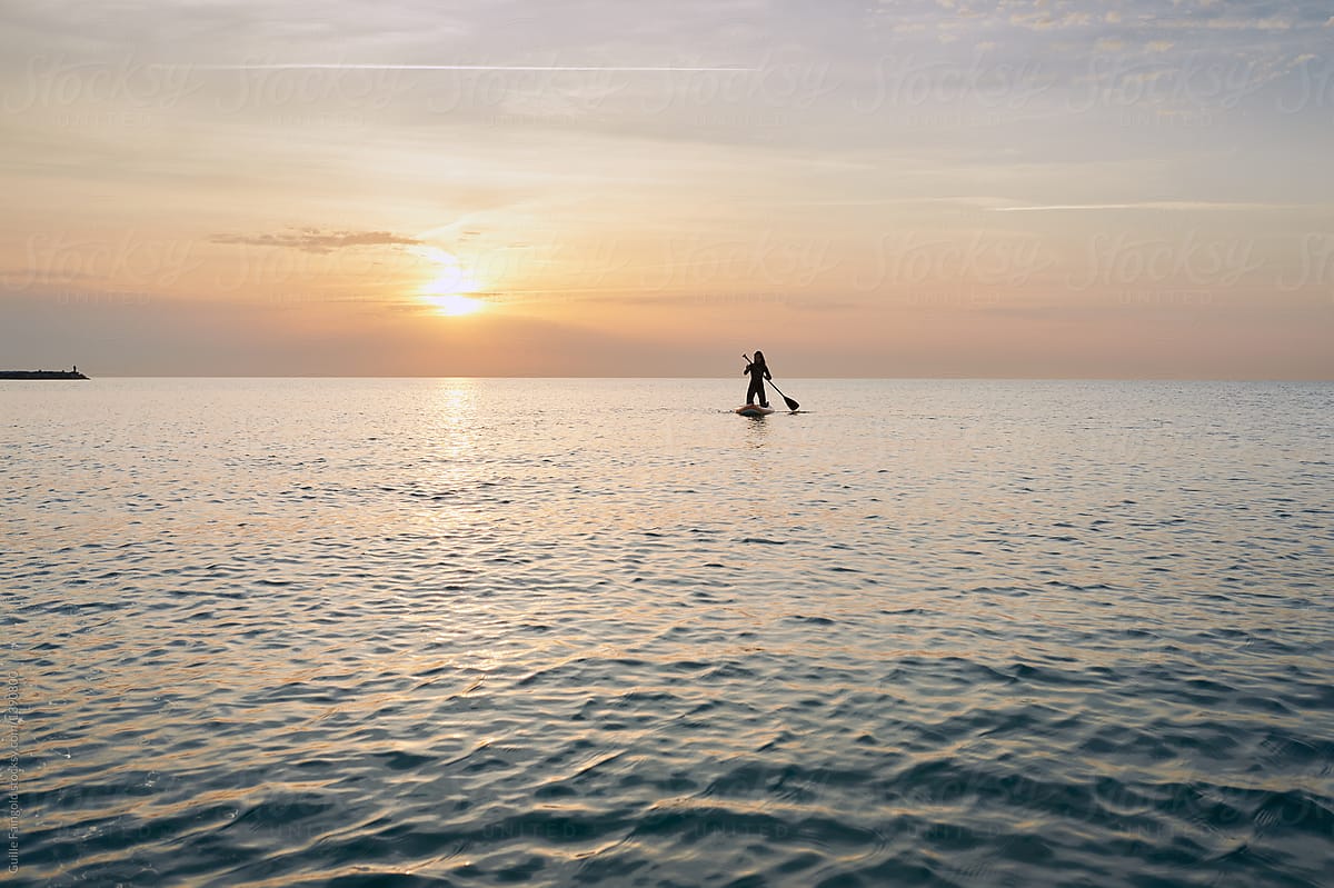 Woman On Sup In Sea By Stocksy Contributor Guille Faingold Stocksy 