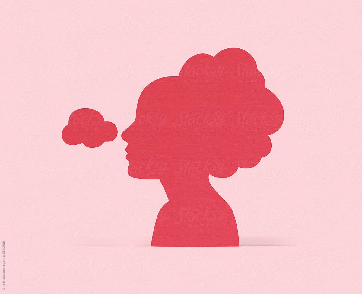 An illustration of a woman\'s head with a pink paper brain cut-out