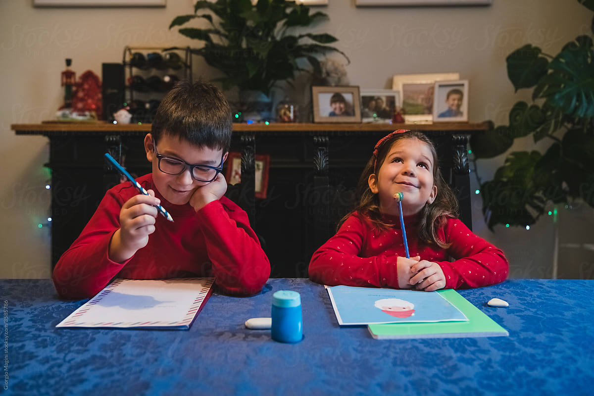 Siblings Writing Letters to Santa Claus