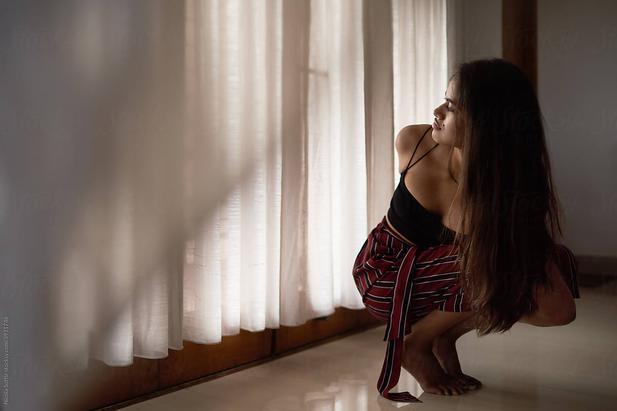 Young woman practicing yoga asana
