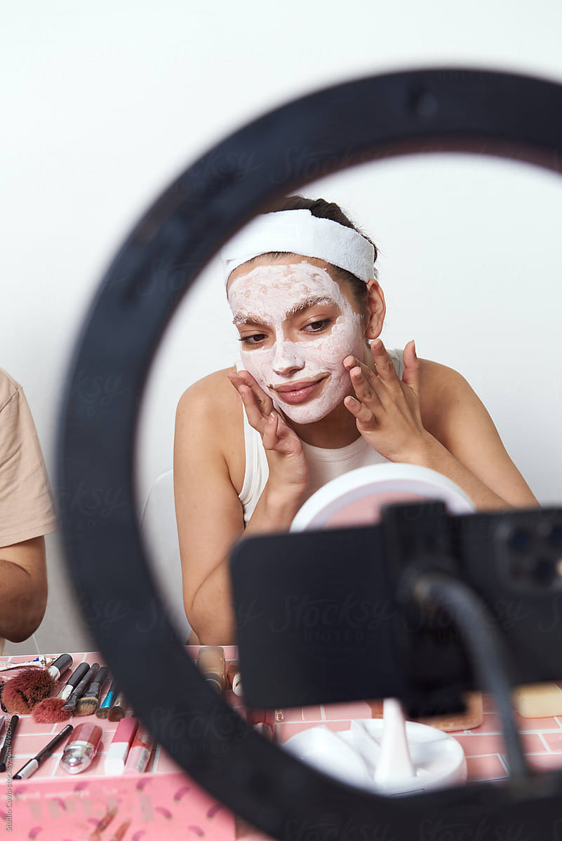 Beauty bloggers recording their makeup routine