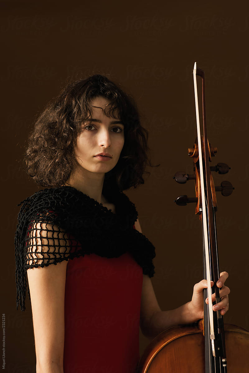 Beautiful young woman with cello