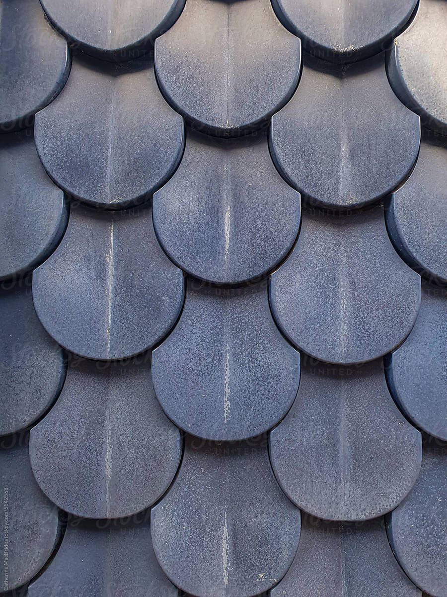 Rounded overlapping  blue ceramic tiled building cladding
