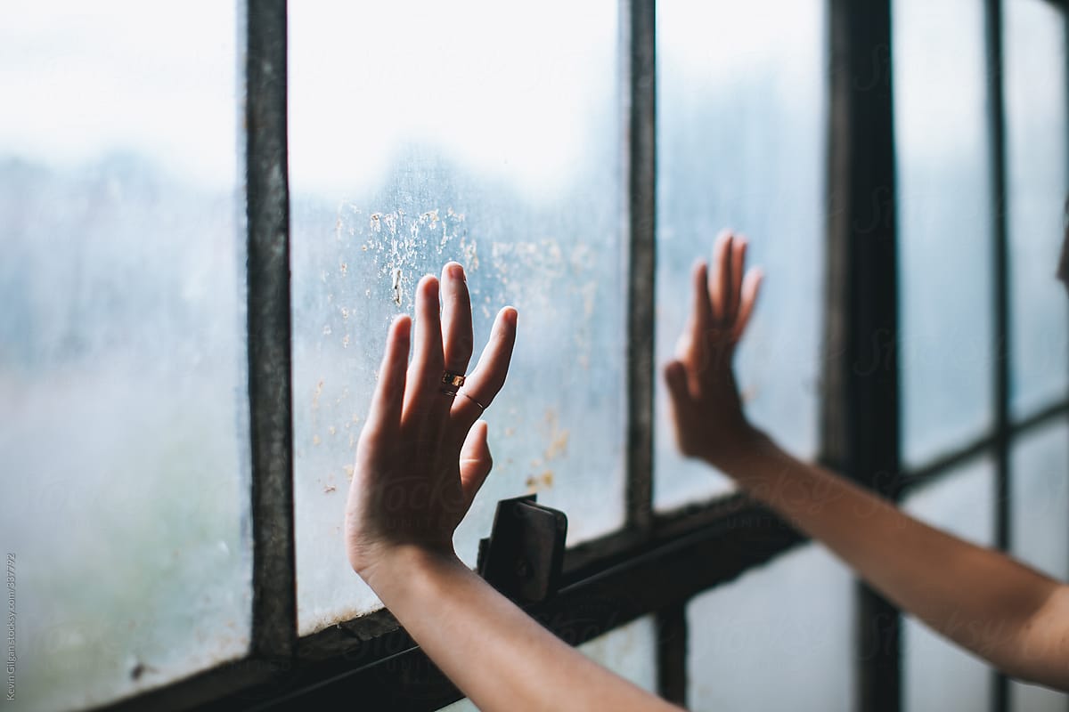 Hands on a Dirty Window