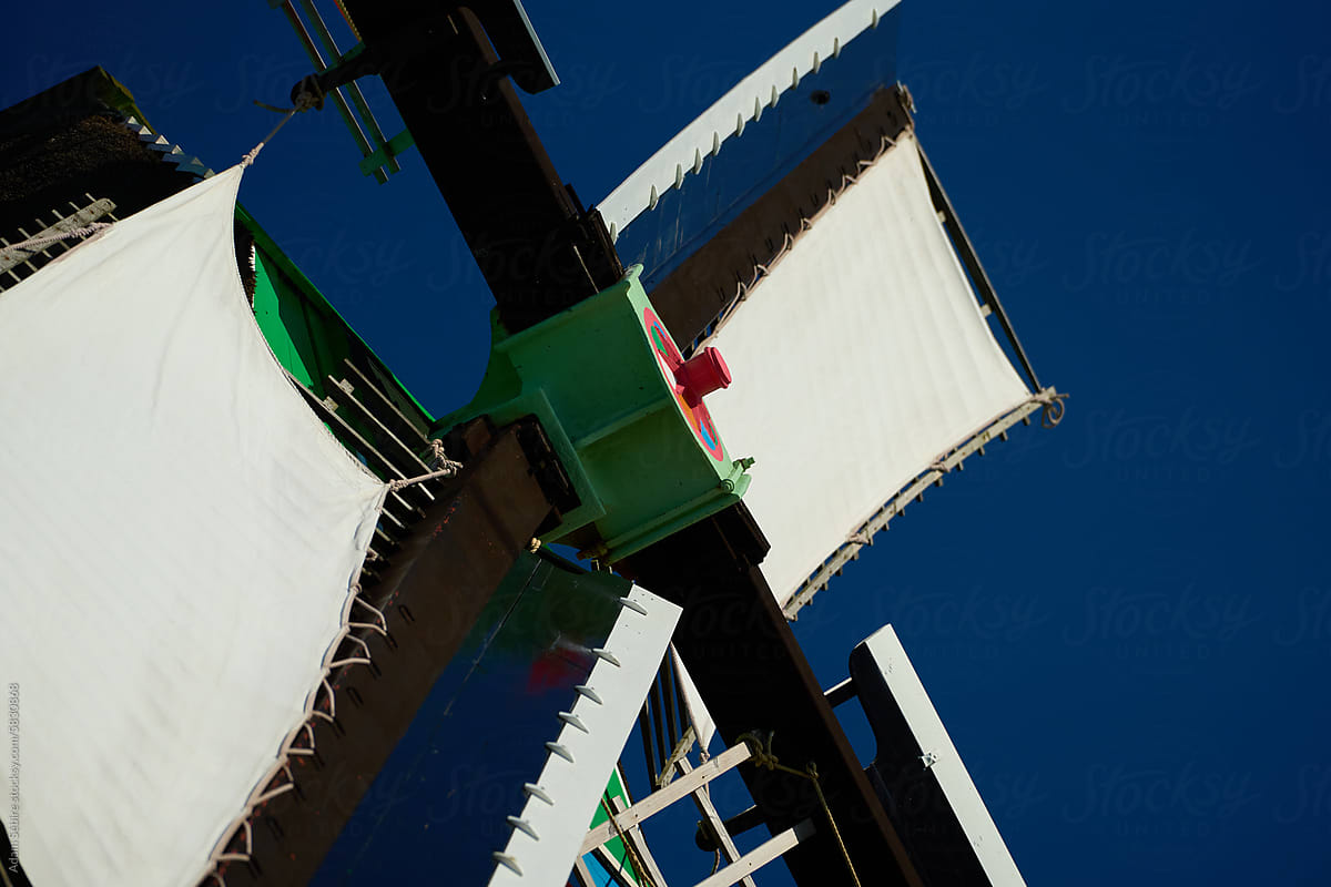 Sails turn Dutch windmill blade, wind power clean green energy