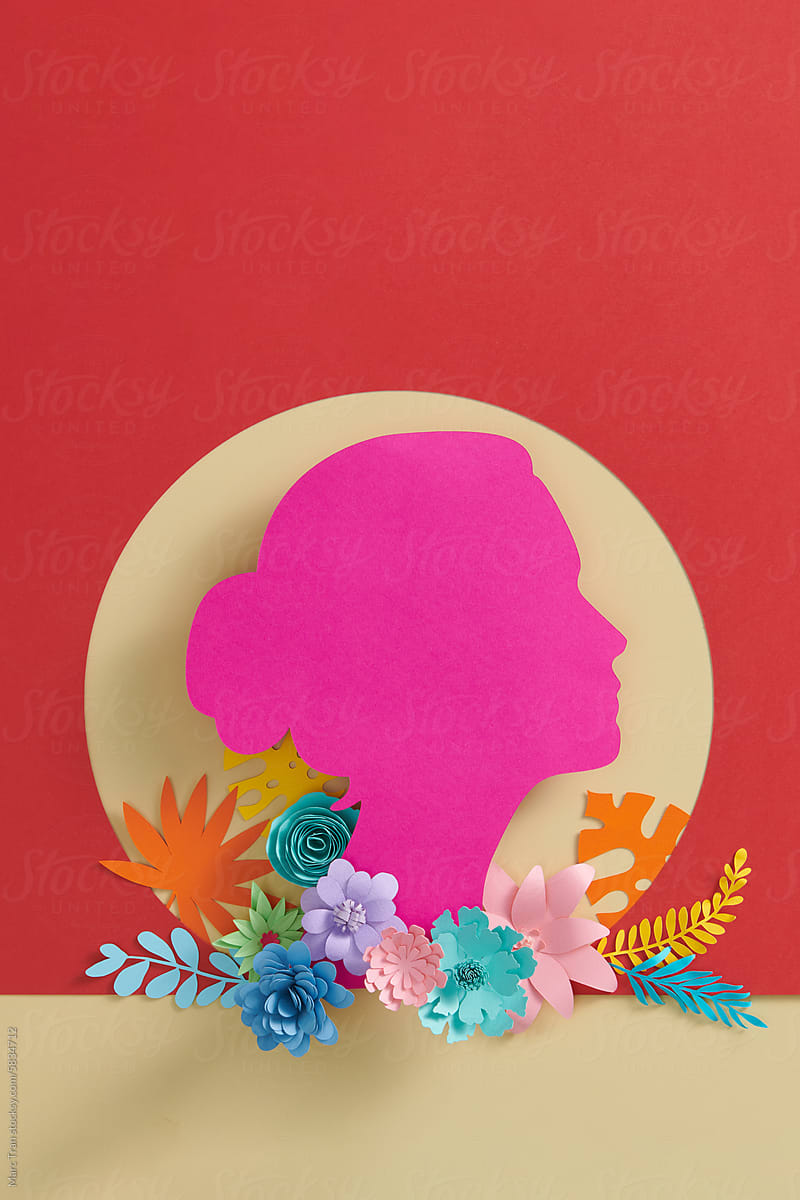 Paper cut girl head silhouette cutout with colorful flowers