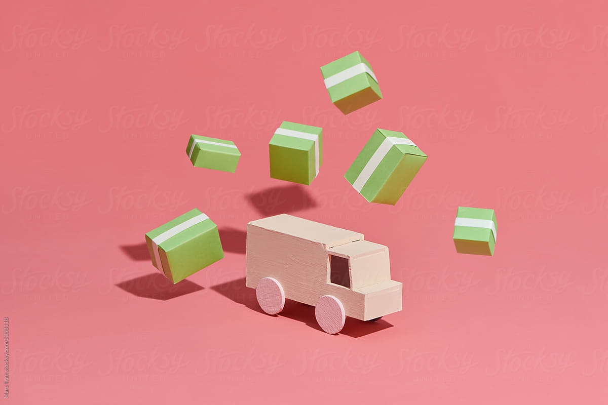 Transport truck with cardboard boxes isolated on pink background