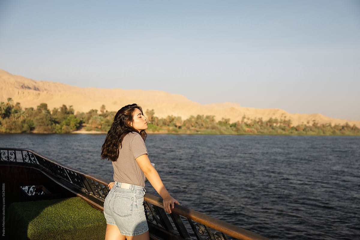 A woman enjoying on a cruise along the Nile River