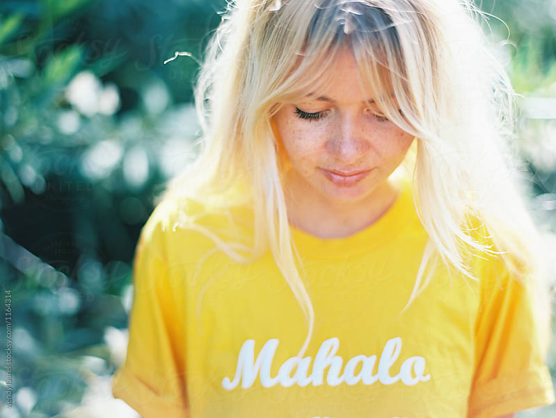 Blonde Girl In Yellow Mahalo Tee Shirt By Wendy Laurel Stocksy United 