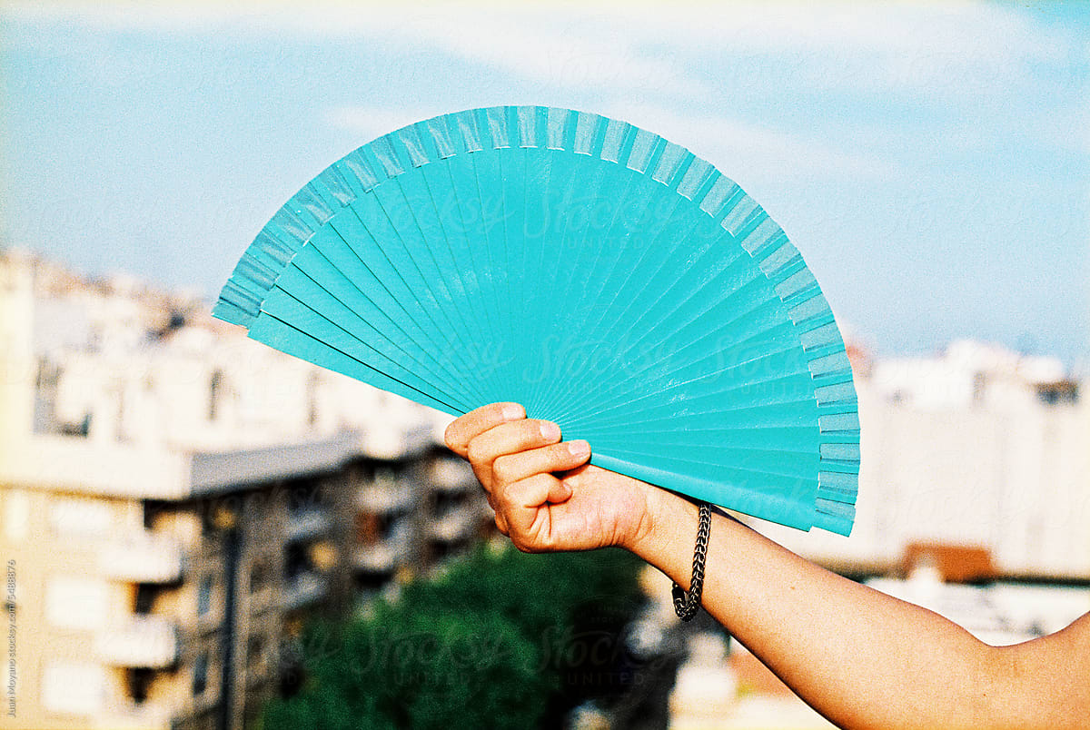 man using a blue fan, 35mm film