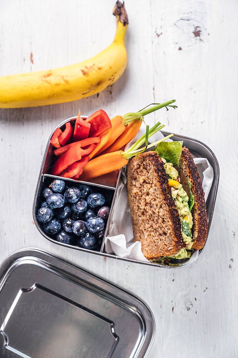 Food: Lunchbox with sandwich, vegetables and fruits