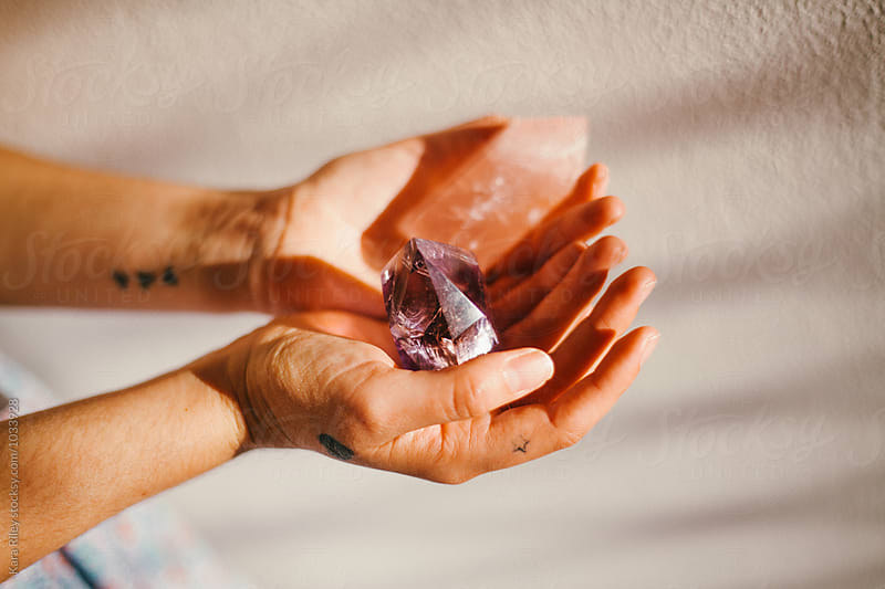 Woman\'s hands holding crystals