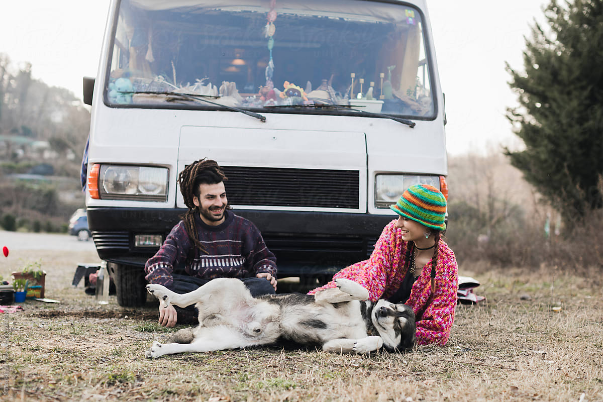 happy young couple with dog