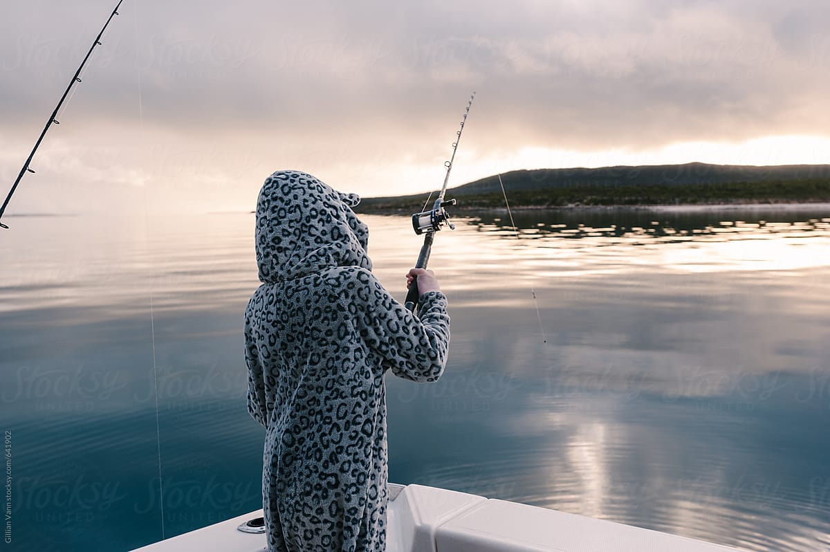 Early Morning Fishing Off The Back Of The Boat, Still In Pyjamas by  Stocksy Contributor Gillian Vann - Stocksy
