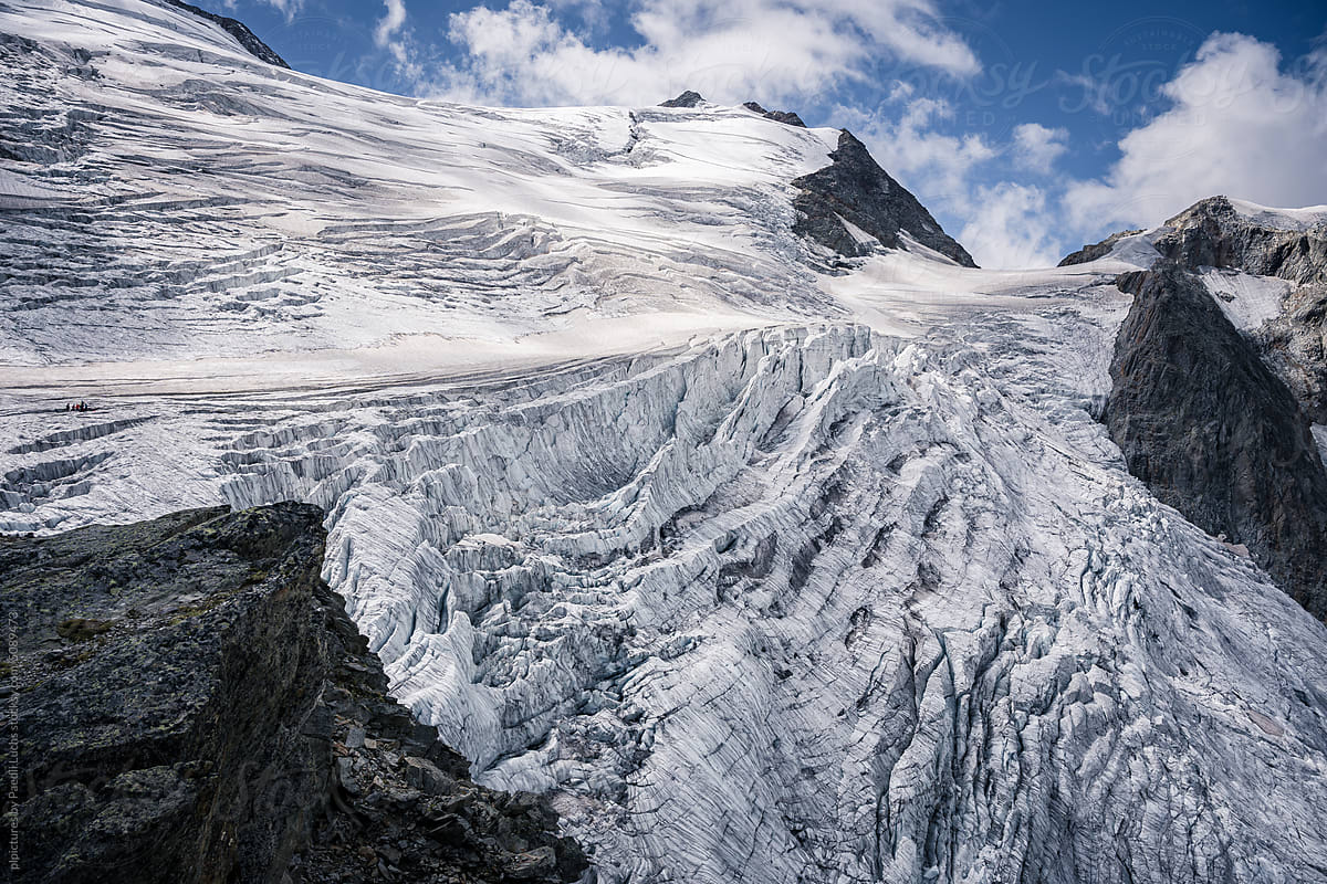 Aerial vie on hanging glacier with crevasses in the alps.