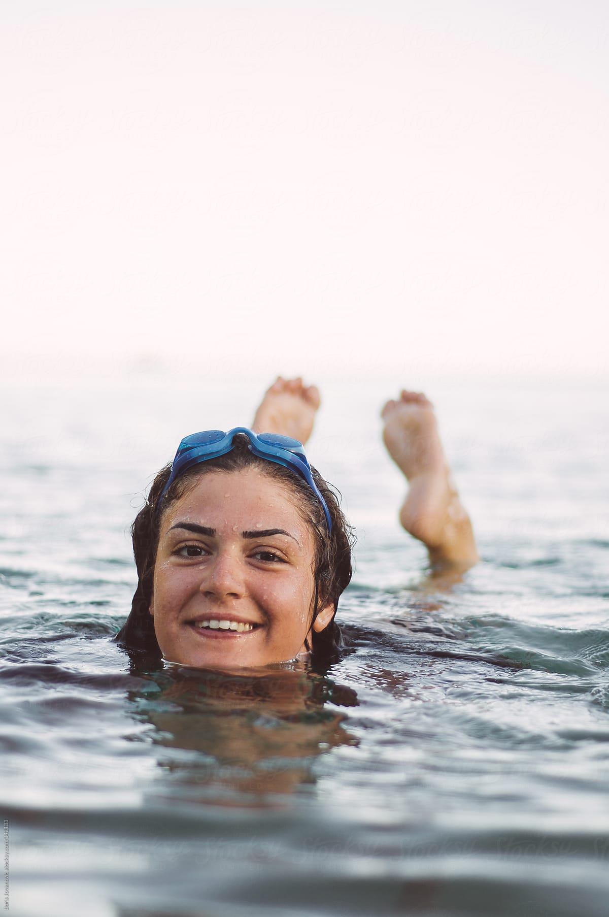Young Girl Enjoying Dusk In Water By Stocksy Contributor Boris Jovanovic Stocksy