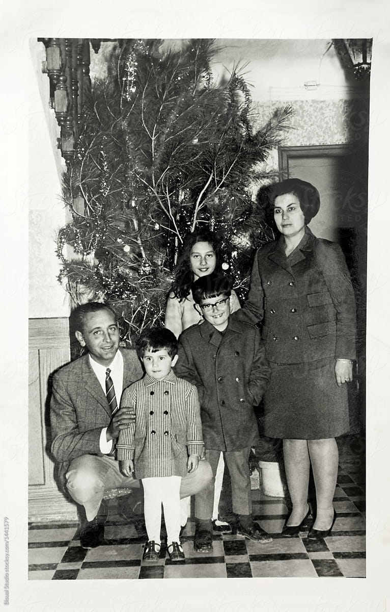 Old scanned photo of a family in Christmas Day (1968)