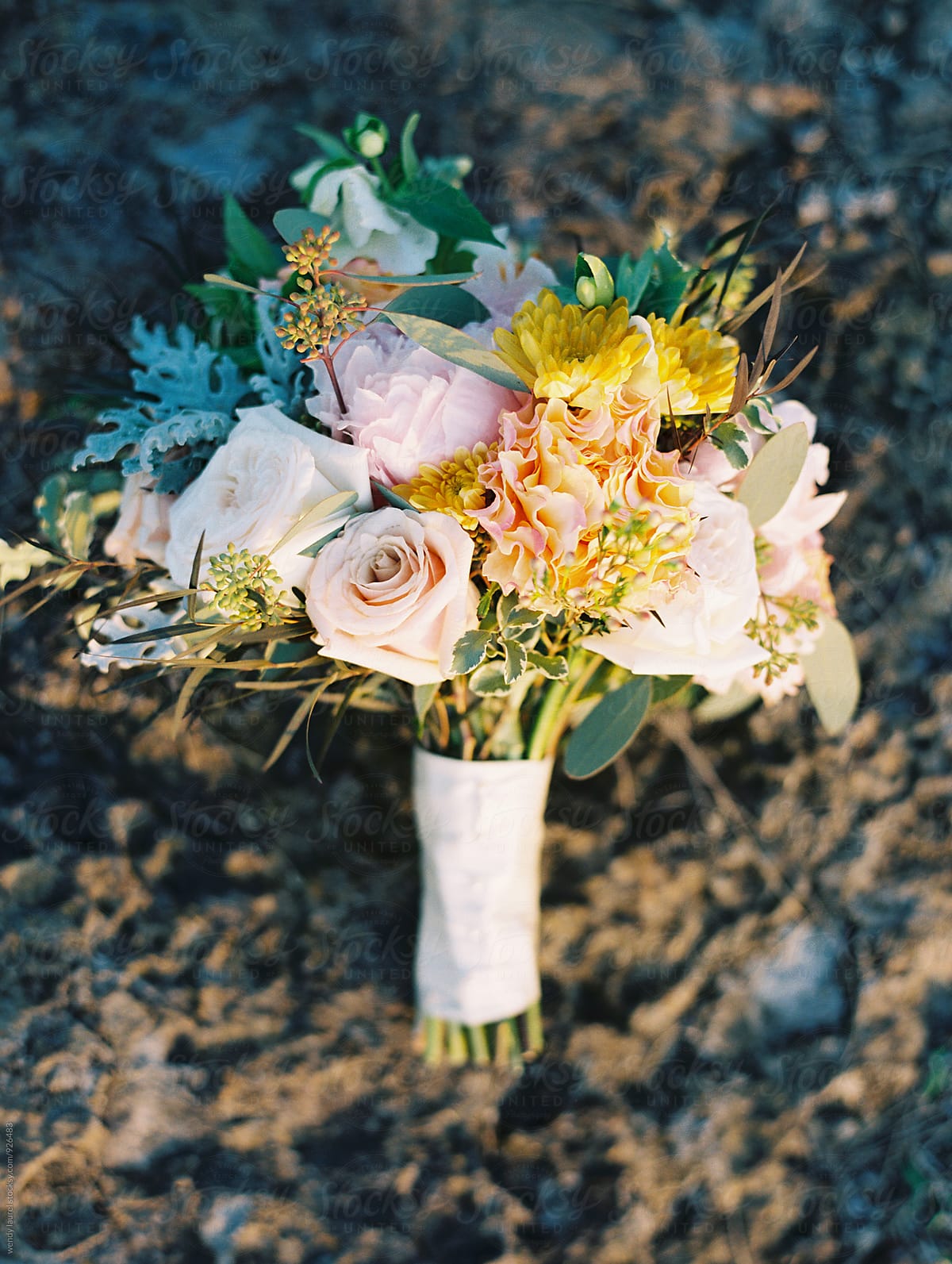 colorful wedding bouquet on rocks