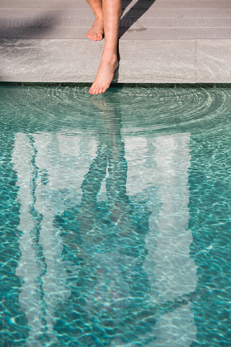 Girl Dipping Foot in Pool