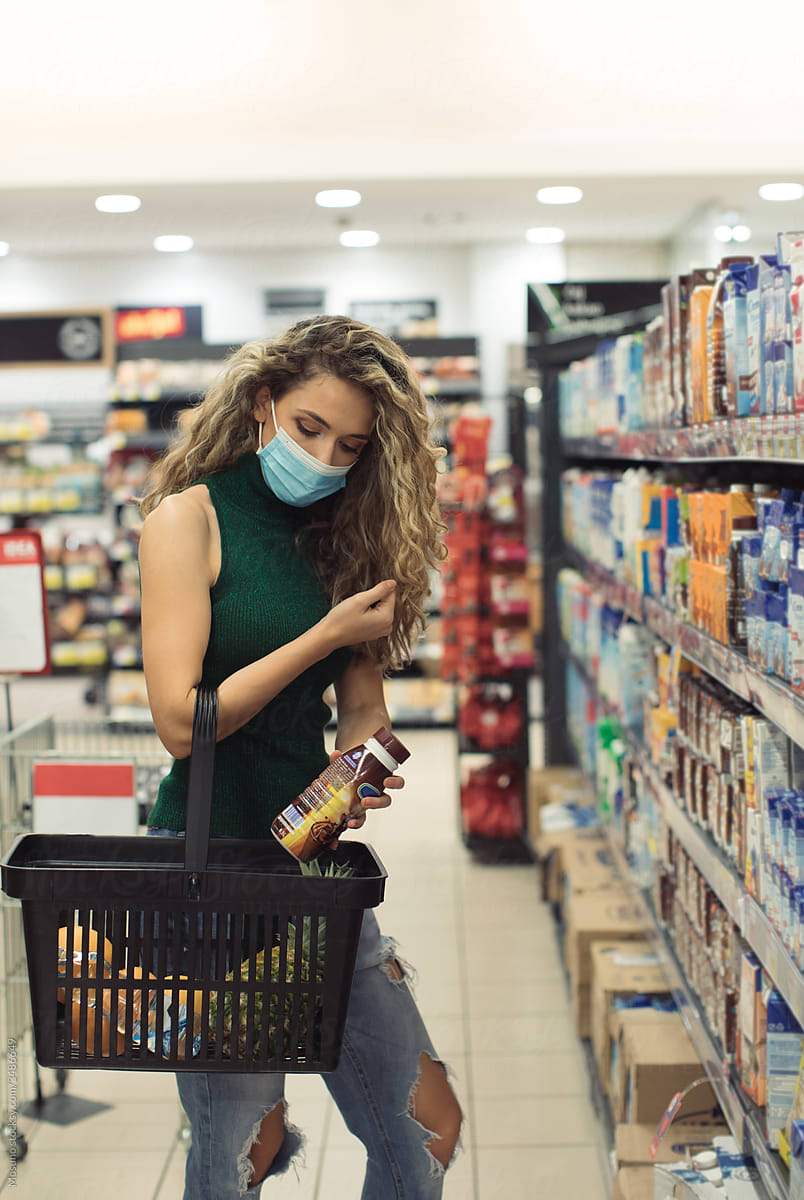 Young Woman Buying Groceries in the Supermarket