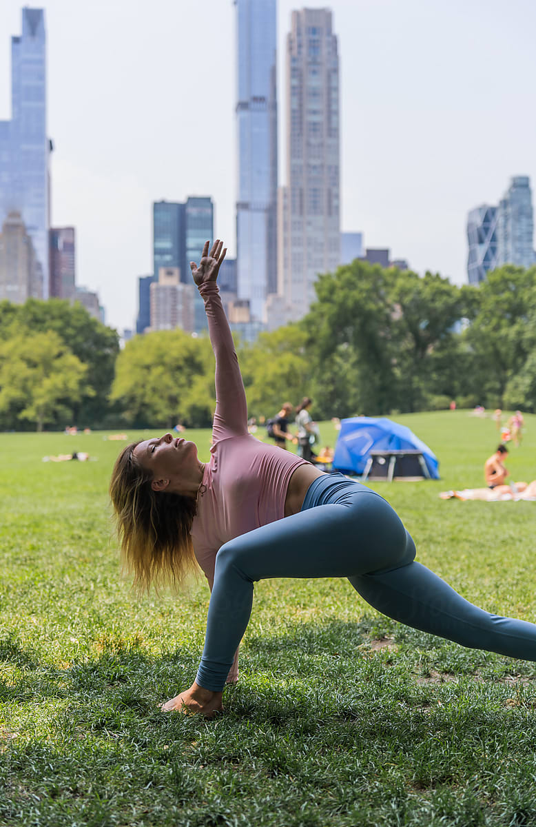 Woman Doing Yoga In Central Park, NYC.