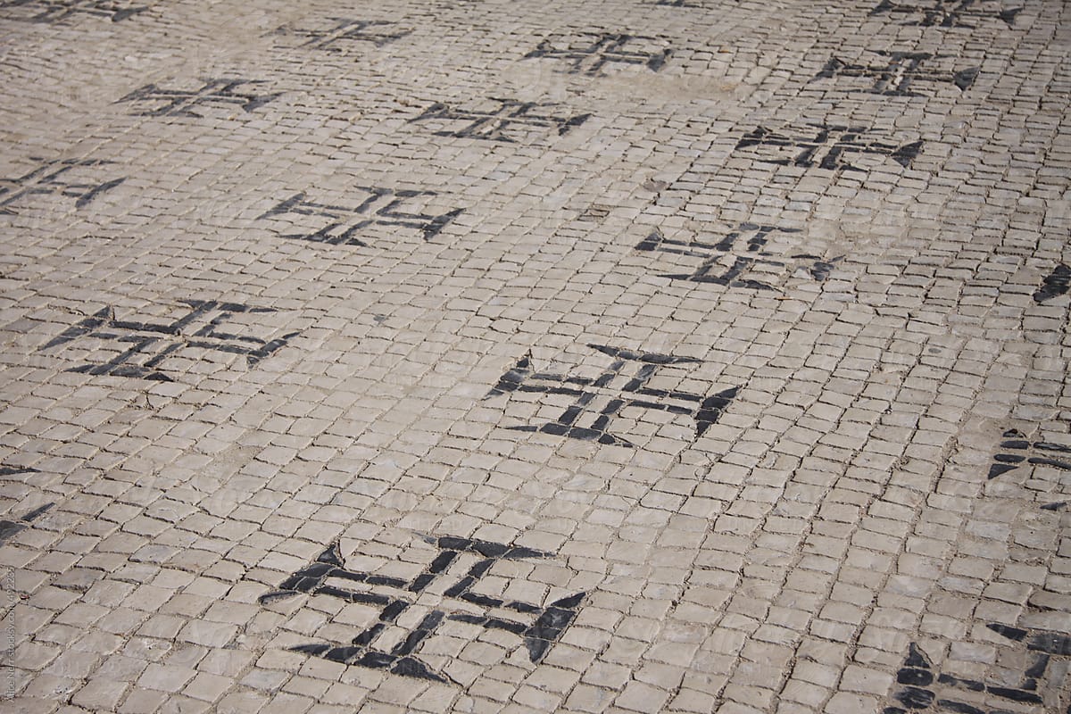 Block-stone pavement with Knights of the Temple sign