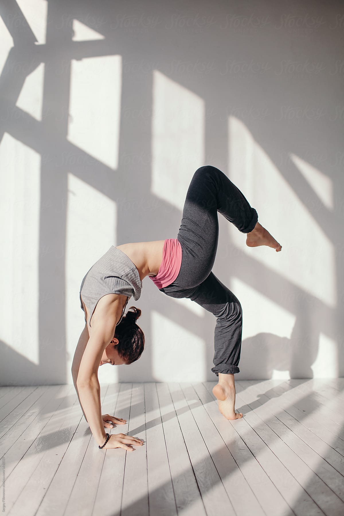 Flexible Woman In Yoga Pose By Stocksy Contributor Sergey Filimonov