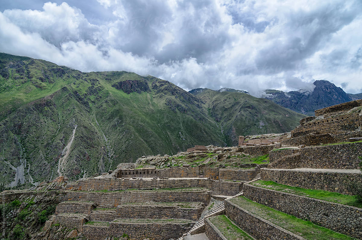 View to ancient Inca ruins under cloudy sky