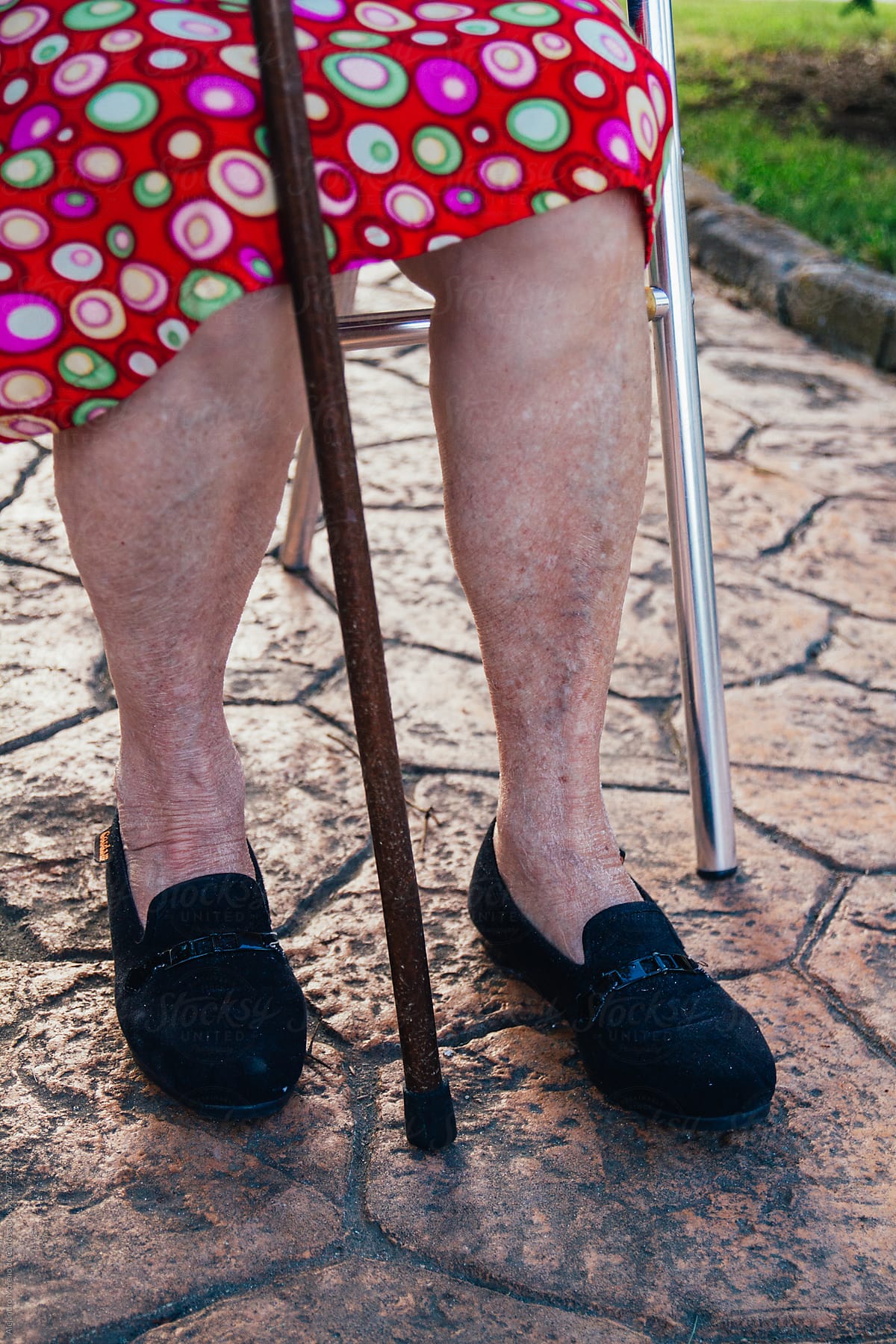 Senior woman legs and cane close up shot
