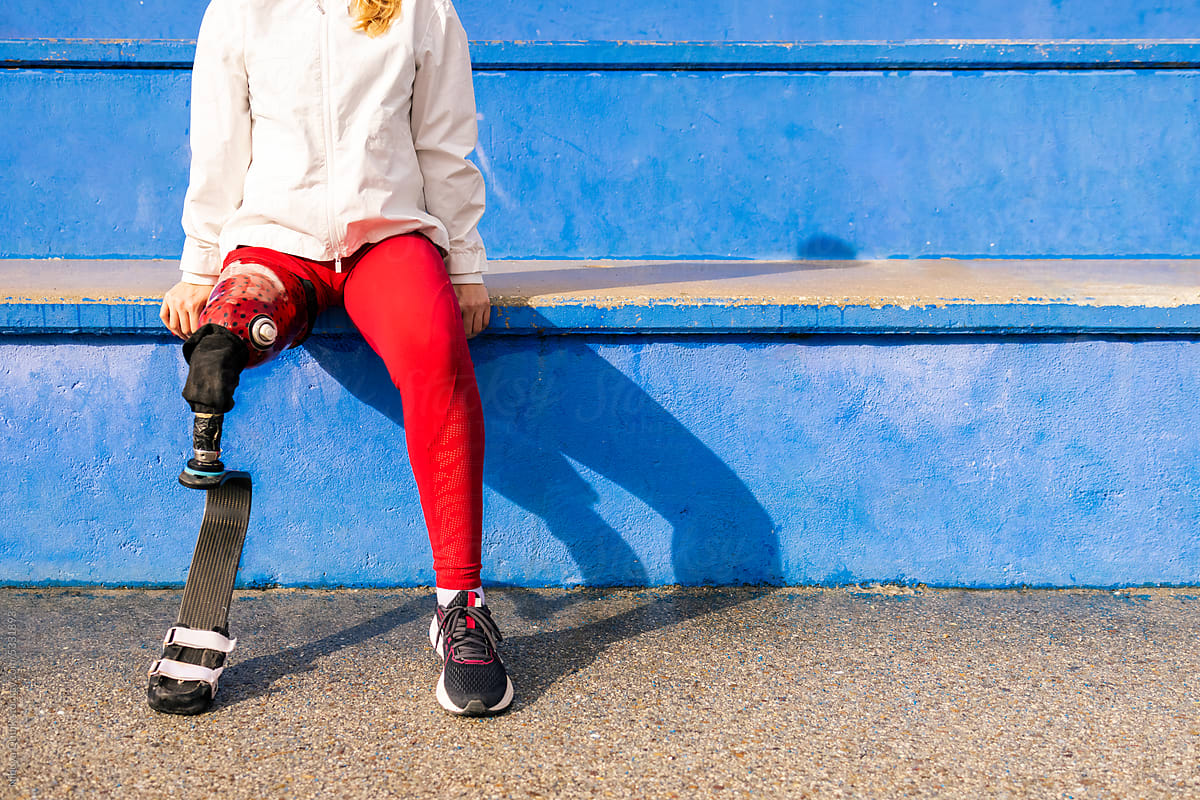Lower body of paralympic woman athlete with bionic leg prosthesis