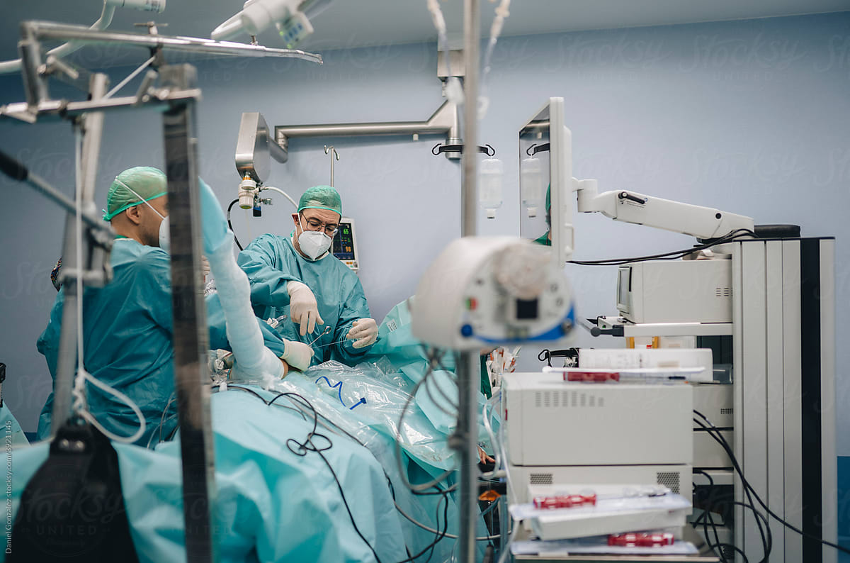 Surgeons performing operation in modern hospital