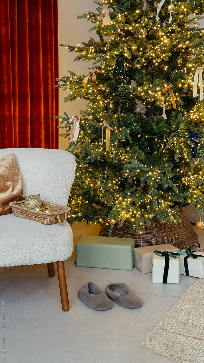Cozy living room with Christmas tree and garland
