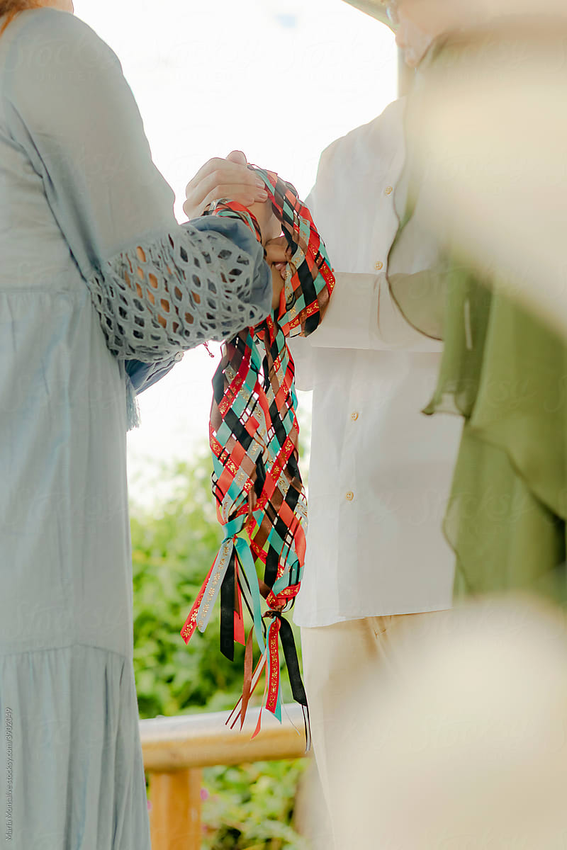 Couple tied hands with Celtic ribbon