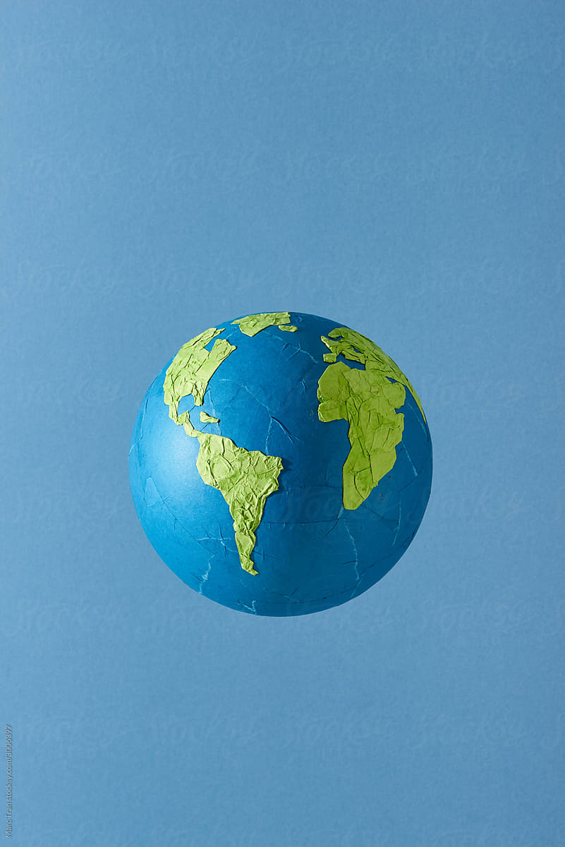map of planet earth shape in recycled papercut craft