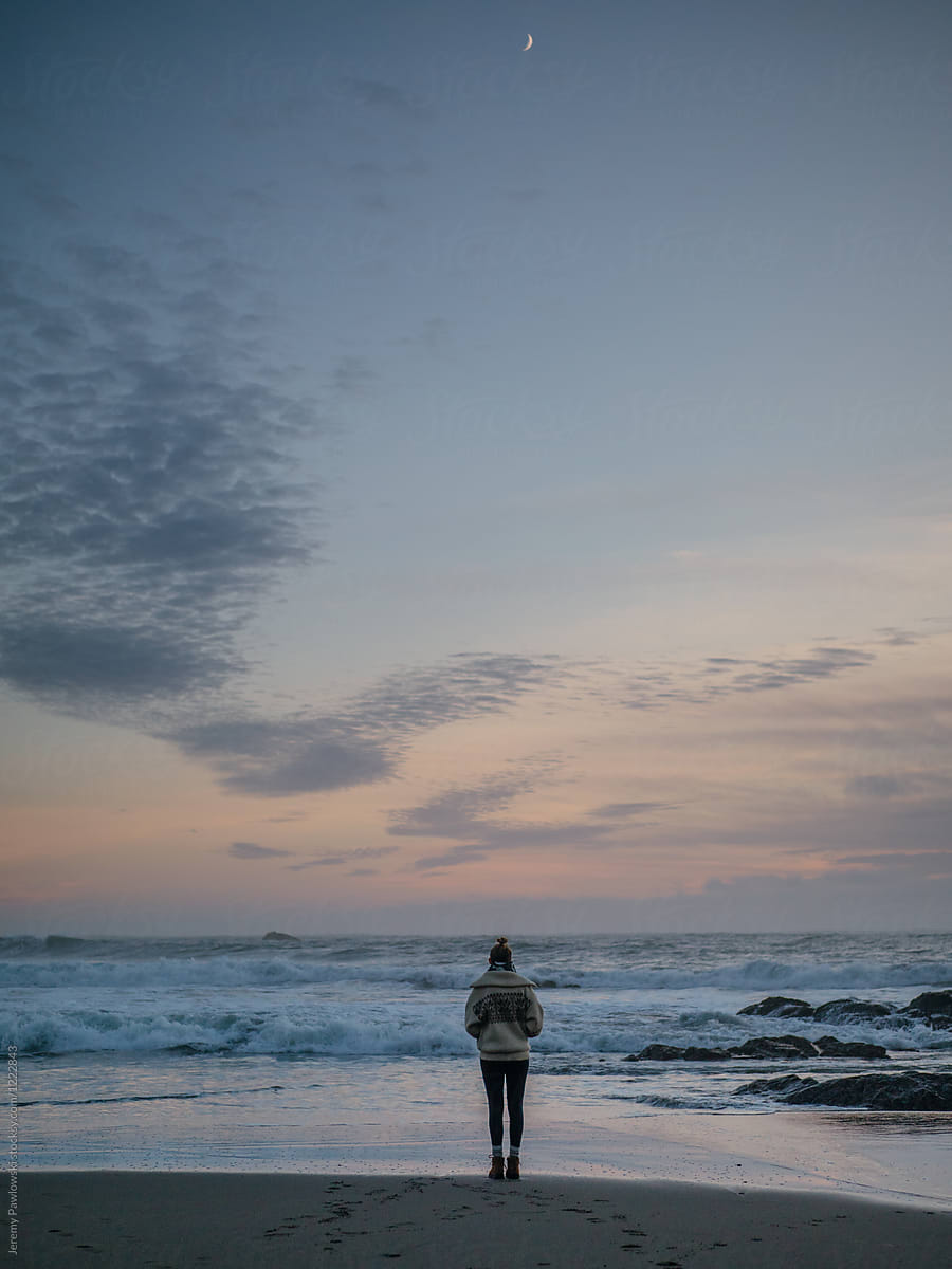Woman Watching Sunset From Beach