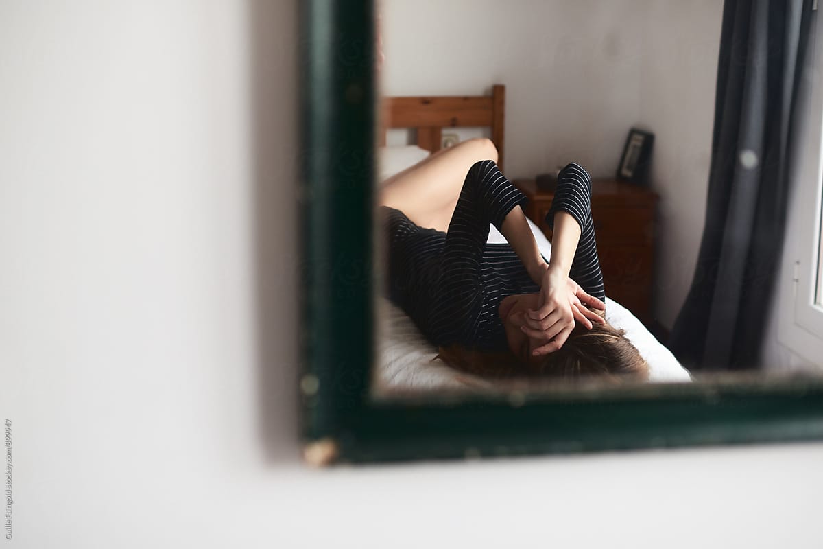 Reflection Of Woman Lying On Bed By Stocksy Contributor Guille Faingold Stocksy 0711