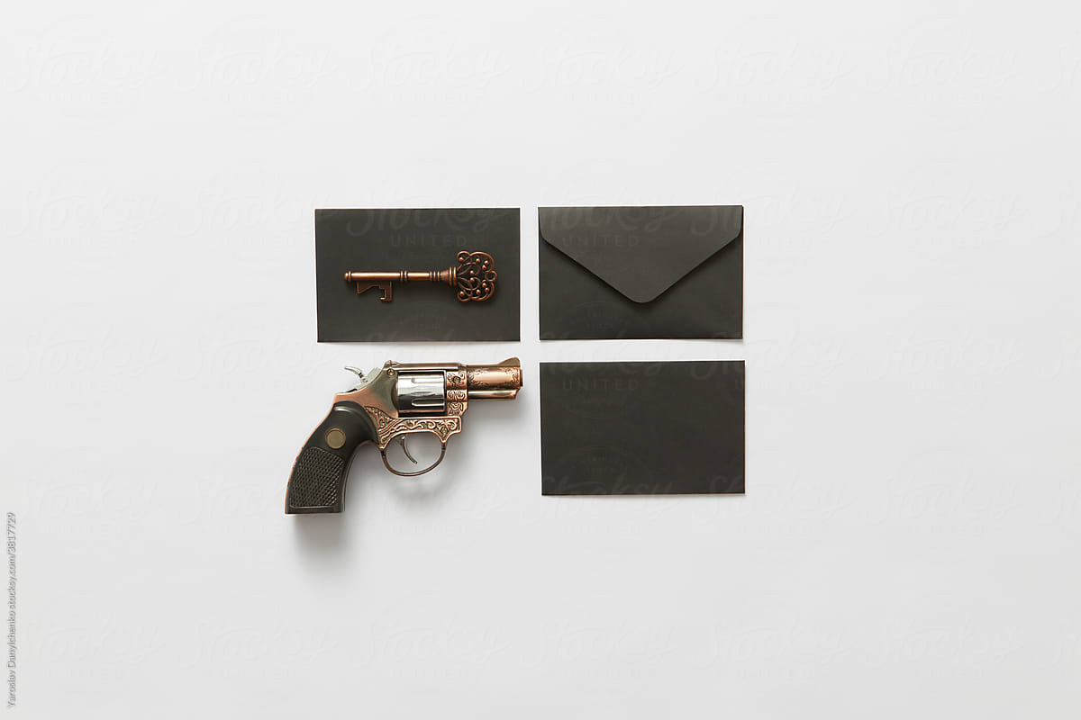 Black envelopes with key and gun