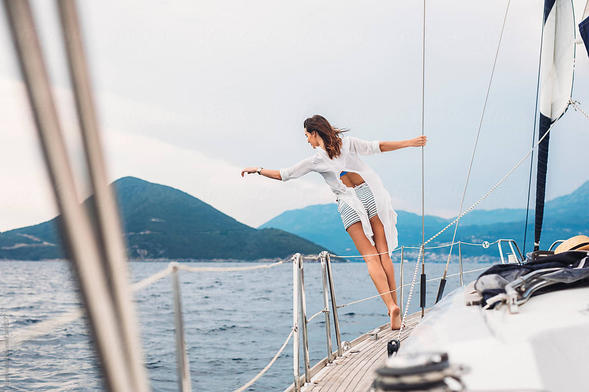 Woman Enjoying Summertime on Sailboat