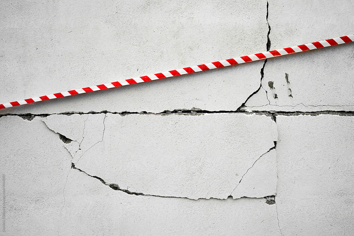 A tape that tries to support a shattered wall.