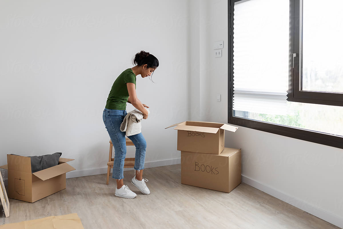 Young woman moving at new home