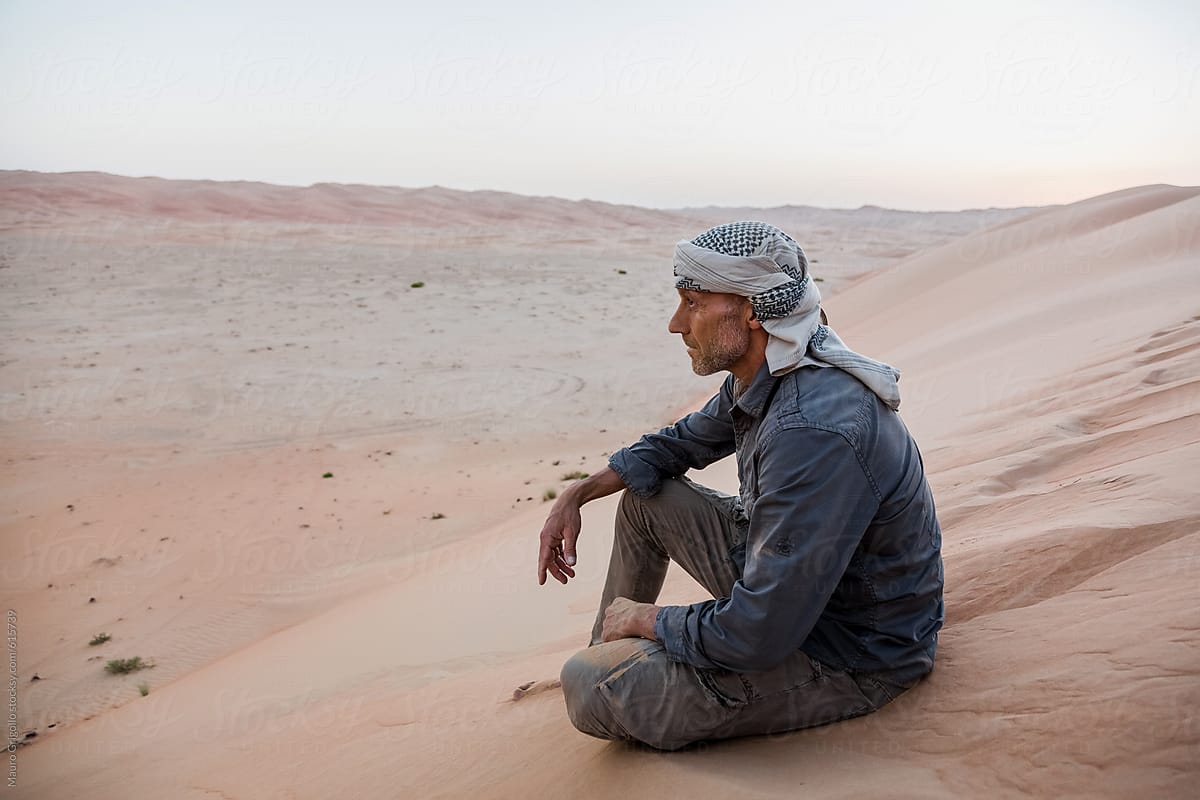 Pensive man in the desert