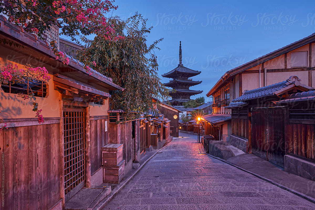 Pagoda at end of traditional Asian street at sunrise