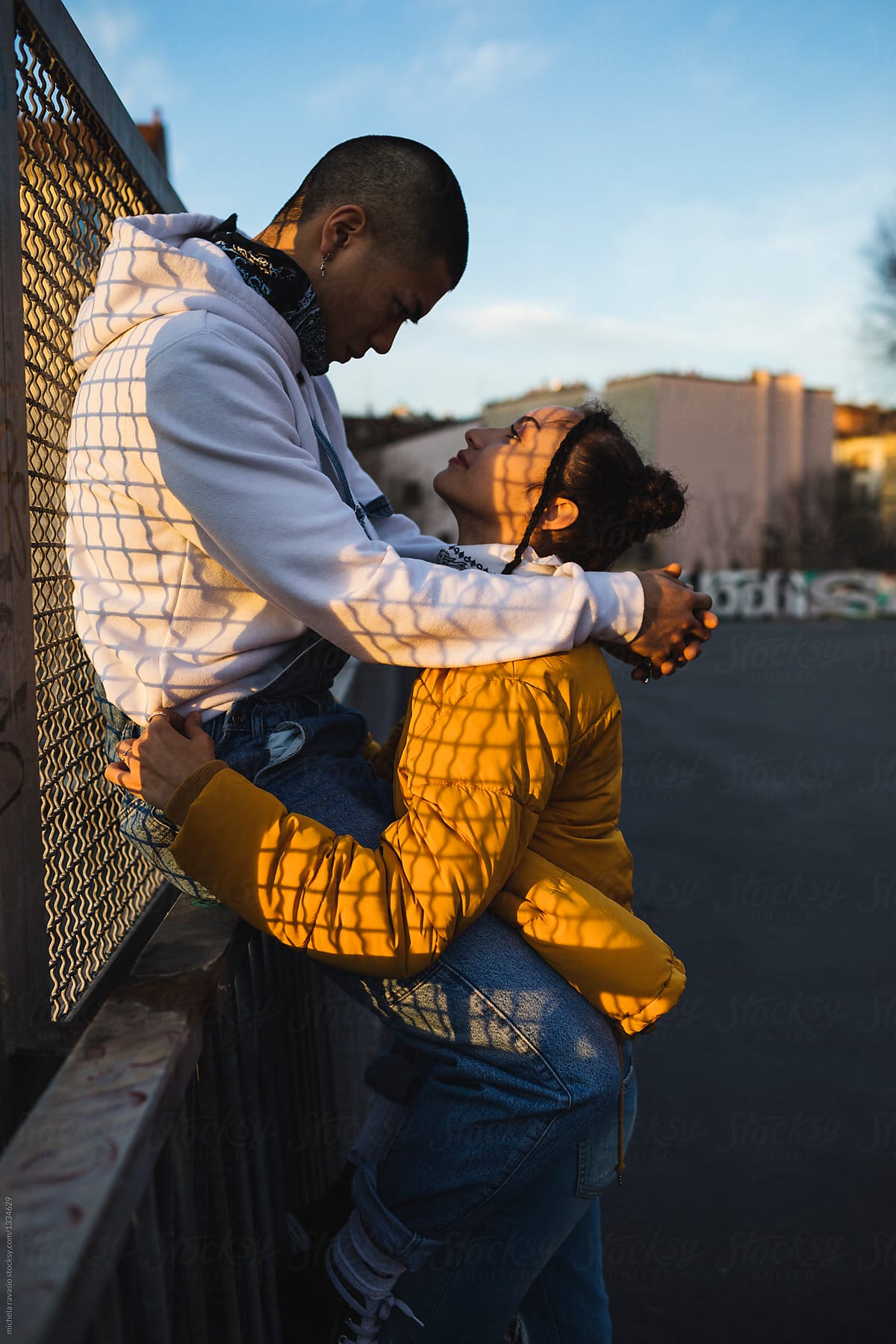 Couple Embraced At Sunset By Stocksy Contributor Michela Ravasio Stocksy