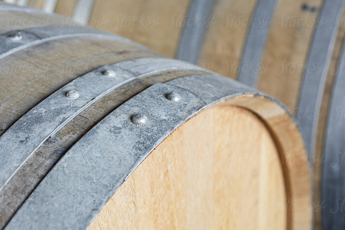 Closeup of the aluminum hoops of a wooden barrel for wine